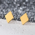 Detailed view of matte gold geometric rhombus earrings in durable stainless steel - Diamond / Gold