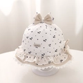Detail of baby sun hat with navy hearts, lace trim, and delicate bow decorations - 48cm (5-18 Months) / Beige