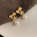 Detailed macro view of baroque pearl earrings with golden flower clusters in vintage style - Style 25 - Silver Earring Post