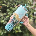 Light blue 40oz insulated tumbler with handle, straw and landscape floral pattern - 40oz / Forest Cloud Pavilion