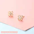 Golden clover stud earrings with sparkling white zircons and milgrain edge details - Fireworks