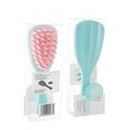 Ergonomic mint green scalp massager with pink silicone bristles in retail packaging - PVC Box / Green