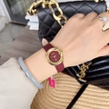 Close-up of elegant gold quartz watch with a red leather strap and matching red dial - Gold/Red (Round Mehdi Style)