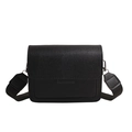 Minimalist black crossbody bag with flap closure and wide fabric strap on white background - Black