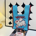 Blue knitted tote bag with red trim featuring a white Vital Rabbit pattern - Running Rabbit Blue