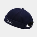 Close-up of white New York embroidery on a navy twill cotton street miki hat - Adjustable / Navy Blue