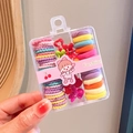 Close-up of colorful elastic hair ties and mini hair clips in a portable storage box - Style 3