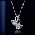 Elegant silver-tone double swan pendant necklace featuring pave-set cubic zirconia stones - Double Swan Necklace Xl-31
