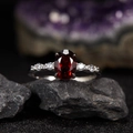Macro detail of S925 silver ring with red garnet center stone and white side gems - Natural Garnet Egg Shape Ring LR372