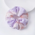 Tie-dye purple and orange organza scrunchie displayed on a white ceramic plate - Purple Dreamy Scrunchie