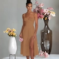 Detail of a brown slim-fit slip dress with front slit and waist-cinching design - Caramel color