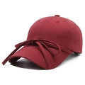 Burgundy cotton baseball cap featuring a decorative ribbon bow on the front panel - Red