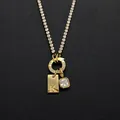 Stainless steel necklace with letter K and cubic zirconia charms in 14K gold finish - Letter K (XNL0116)