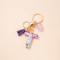 Letter T keychain with purple glitter resin, leather tassel and golden lobster clasp - Letter T