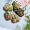 Polished 2cm green and pink natural gemstone heart ornaments in a circular arrangement - Unakite