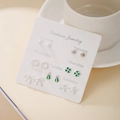 7-day earrings set in silver finish with green clover and pearl charms on white card - Green Clover Flower Style (E1988-1)