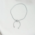 Silver snake chain bracelet with adjustable slider bead on silk fabric background - Simple Style / Silver Adjustable Snake Chain