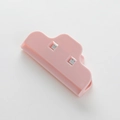 Pink mountain shaped plastic food bag sealer clip with metal spring on white background - OPP Bag Nordic Pink
