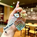 Luminous star glitter liquid keychain with golden bell and Sweet Heart strap charm - Black Luminous Bubble Dice