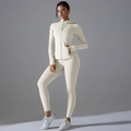 Detail view of cream white sun-protective yoga set with zipper hoodie and thumbhole cuffs - S / Light Ivory