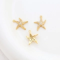 Macro detail of three 14k gold plated starfish charms with clear zircon inlay - 5# 18k Starfish