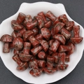 Polished red jasper stone mini mushrooms in a white shell bowl for home decor - Sesame Jasper
