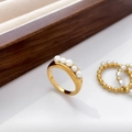 Macro detail of gold-plated pea pod ring with freshwater pearls and crossed lines design - US 6 / Freshwater Pearl Pea