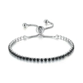 Macro shot of adjustable sliding clasp on tennis bracelet with black square-cut zircons - White Gold + 2.5mm Round Black Stone