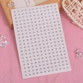 Clear crystal face gems sticker with round silver rhinestones on pink gauze background - White Small Round Rhinestones