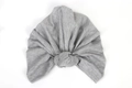 Detailed close-up of light grey knotted headwrap showing soft stretch knit fabric texture - Gray