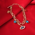 Detail of rose gold evil eye bracelet with blue teardrop gems on red silk fabric - 【5158】Eye Bracelet Rose Gold