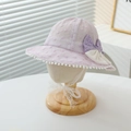 Detailed view of a baby girl's purple lace sun hat featuring a cute polka dot bow - 50-52CM / Purple