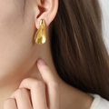 Chic gold plated titanium steel teardrop earrings worn by model for elegant look - Irregular Geometric Earrings / Gold (F1047)