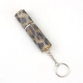 Macro view of leopard print rhinestone mini perfume bottle with a metal keychain - Gold Leopard