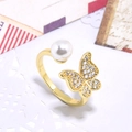 Detailed macro view of a gold-plated butterfly ring with sparkling zircon and pearl accent - Butterfly Pearl Style (ZYN-DMR134G-3)