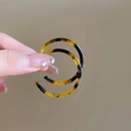 Close-up of tortoise shell pattern C-shaped hoop earrings made of glossy resin material - Brown Tortoiseshell Acetate C-Shape Style (10#)