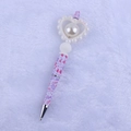 Macro detail of cartoon heart pen featuring a large faux pearl and LOVE pattern print - Big Heart White
