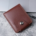 Brown leather men's short wallet with pebble texture and snap button on stone desk - Light Coffee