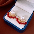 Golden heart flower earrings with white pearl and red beaded tassels in a blue jewelry box - Pearl with Red Bead Tassel Studs