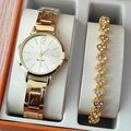 Close-up of golden women's watch and rhinestone heart bracelet in a premium orange gift box - Gold Watch Multiple Heart Bracelet Set