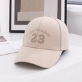 Close-up of the beige baseball cap showing the embroidered number 23 and cotton fabric - One Size / Khaki