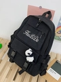 Black canvas backpack with panda pendant and white embroidery on a wooden surface - With Panda Pendant / Black