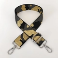 Detail of camouflaged black, grey, and gold woven bag strap with silver metal lobster clasps - Grey Gold Thread + Silver Buckle