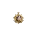 Macro shot of 14K gold sun pendant with round brown gemstone for DIY jewelry making - Feldspar