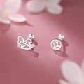 Silver stud earrings with lucky cat and coin design on a soft pink background - Lucky Cat Coin Asymmetric Style (A305)