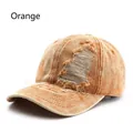 Distressed vintage orange washed cotton baseball cap with ripped hole details for a street style - Adjustable / Orange