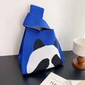 Close-up of blue knitted tote bag featuring a cute black and white panda pattern - Blue Shy Panda