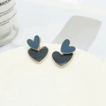 Deep blue and black enamel heart earrings with gold trim on a white platform - Ink Blue Two-tone