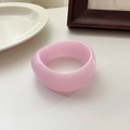 Minimalist wide resin bangle in soft translucent pink finish with a smooth rounded design - Pink