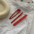 Detailed shot of a 3-piece set of red candy-colored drop-shaped and rectangular hair clips - Red Hair Clip 3Pcs Set